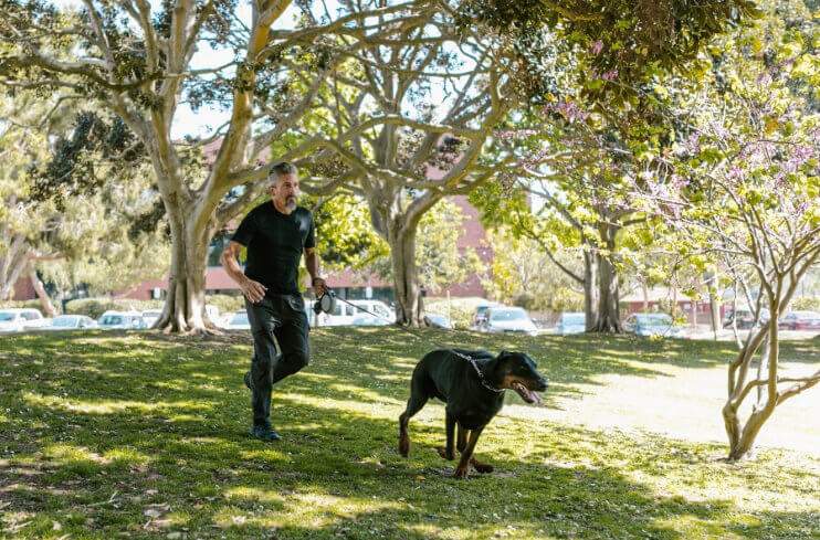 man and dog running